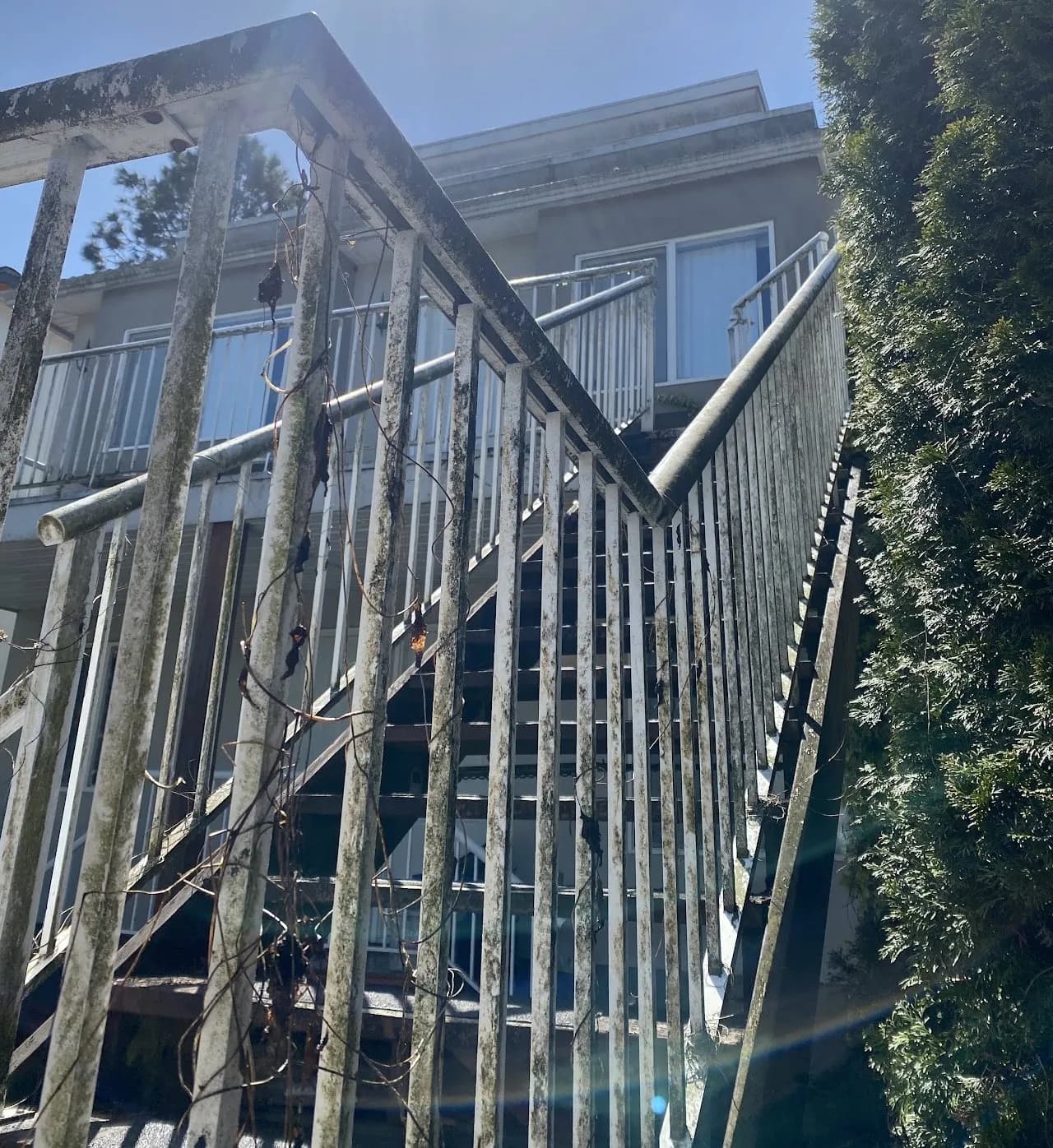 Strata balcony railing glass in Burnaby before cleaning