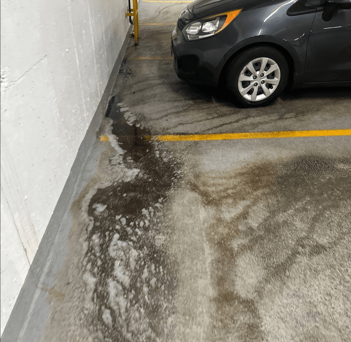 hazard cleaning - oil spill picture in parkade in Burnaby